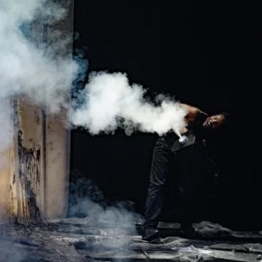 Under the Radar Festival Highlights- New York, January 7-25, 2025. Person surrounded by smoke effects.