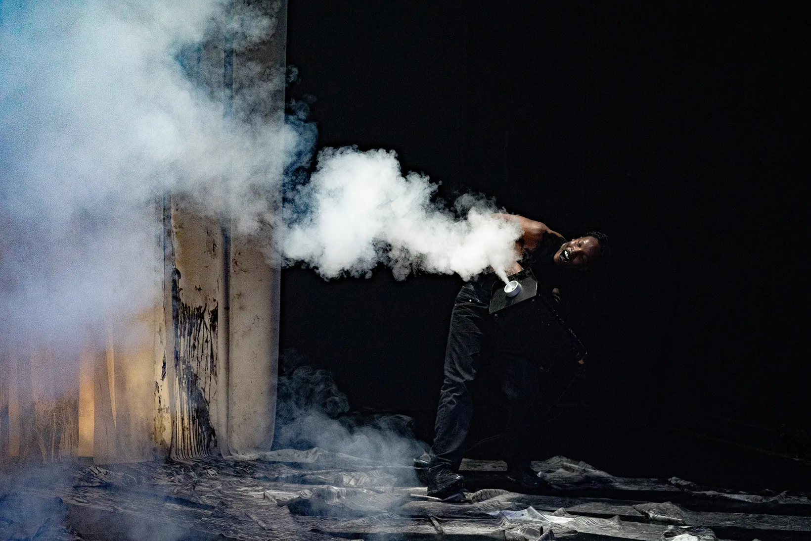 Under the Radar Festival Highlights- New York, January 7-25, 2025. Person surrounded by smoke effects.